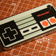 Illustration for article titled Pretend Your iPhone Is Just a Really Impressively Modded NES Controller